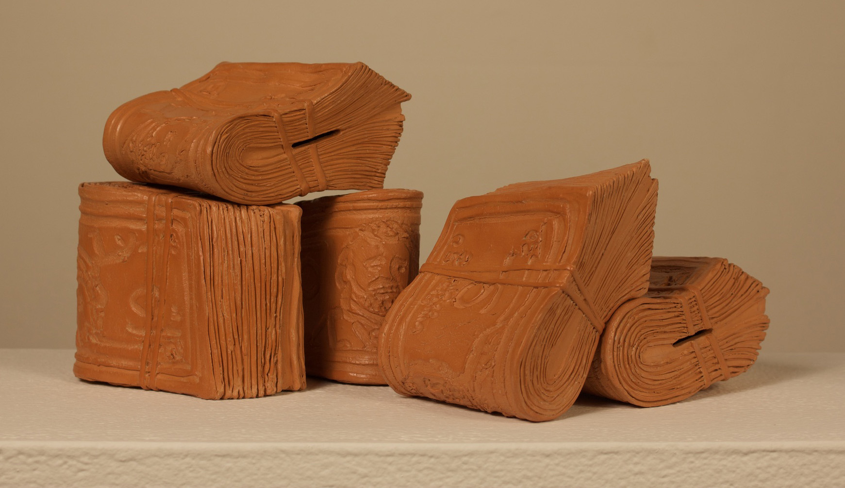 Luciano Pimienta terra cotta and wax titled Biyuyo de 50 depicts 5 folded stacks of currency 