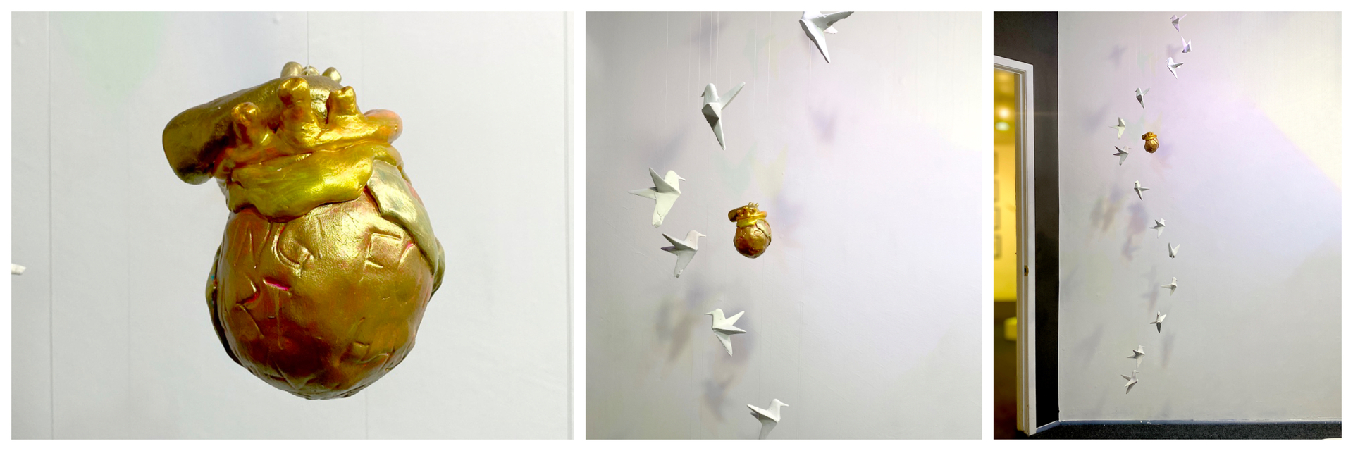 K Ryan Henisey apoxy, clay, cement, acrylic and monofilament used to create cement hummingbirds surrounding a gold human heart sculpture