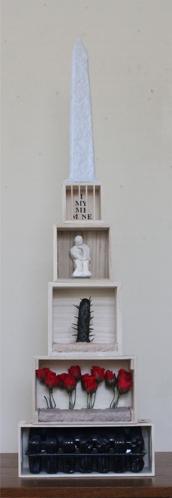 Haesook Lee clay, wood, acrylic, paper and letter stickers assemblage that represents her cultural identity.