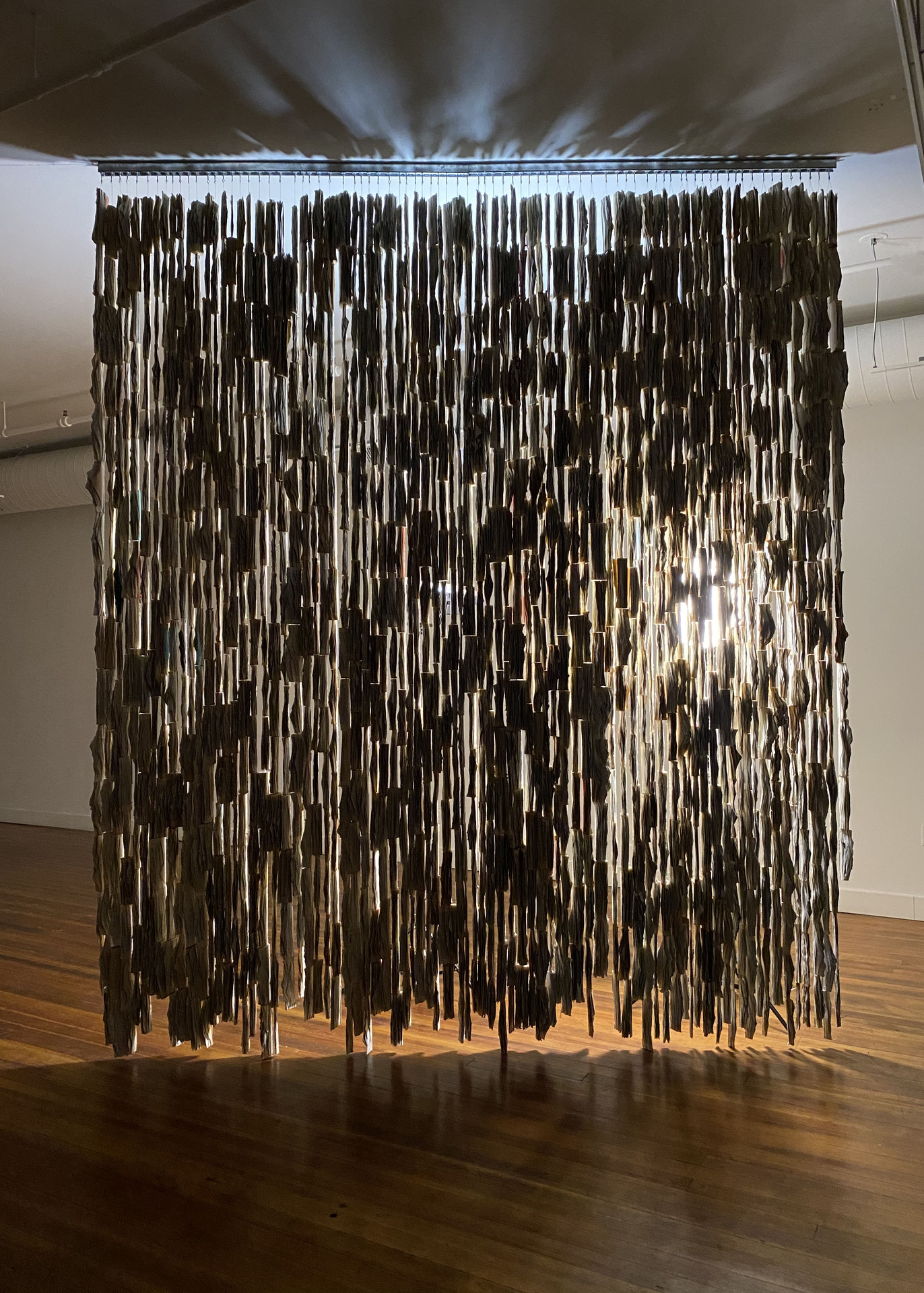 Amanda Love large hanging sculpture of deconstructed books titled Altered Books.